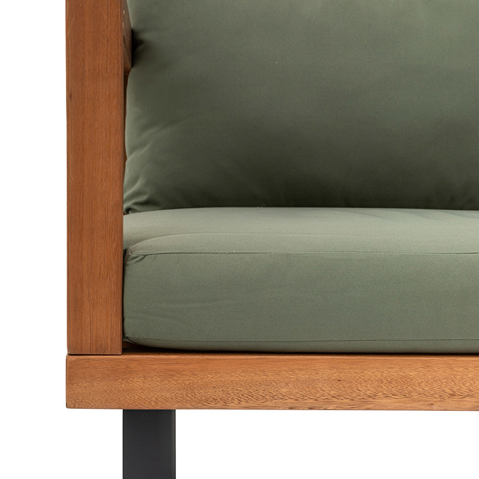 close up on clean lines of wooden outdoor corner sofa, with plush green cushion