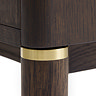 close up image of legs of dark oak cabinet with gold band inlay detail