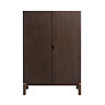 image cut out on white background of dark oak cabinet with two doors and circular cut out in the middle for handle
