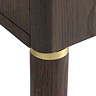 close up image of dark oak legs of tv lowboard, with gold band inlay detail where leg meets base of board