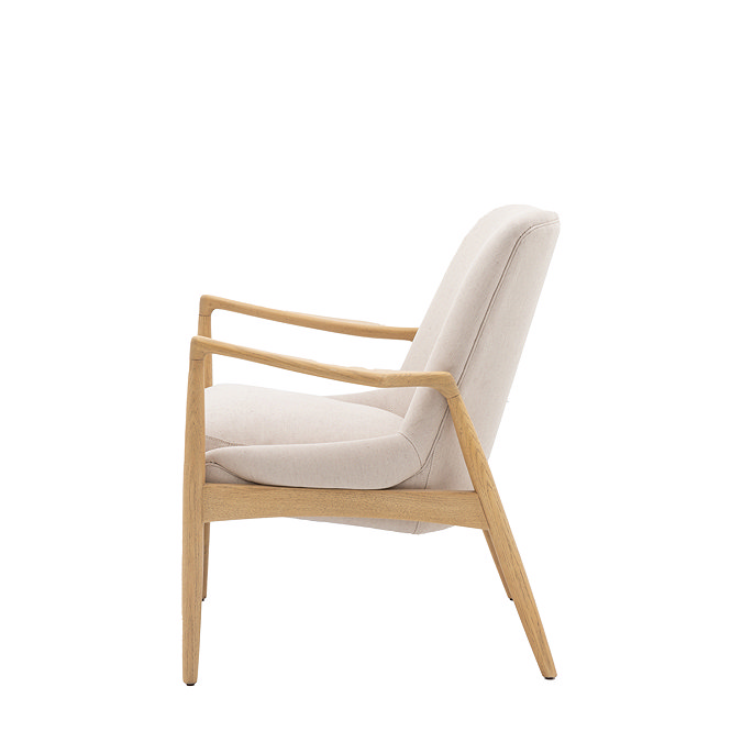 side on cut out image of solid oak accent chair with linen cushions