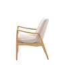side on cut out image of solid oak accent chair with linen cushions