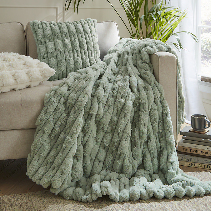 carved faux fur throw on a sofa image 2