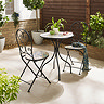 image of colourful tiled bistro set with cast iron framework, on sunny patio