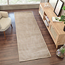 image of beige lined runner on a dark wooden floor in front of rattan sideboard