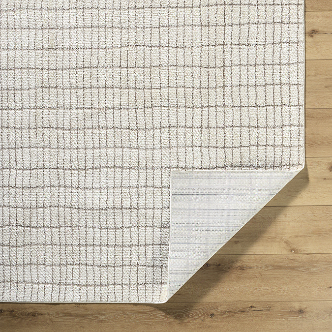 image of ivory lined rug with corner folded over to show material underneath