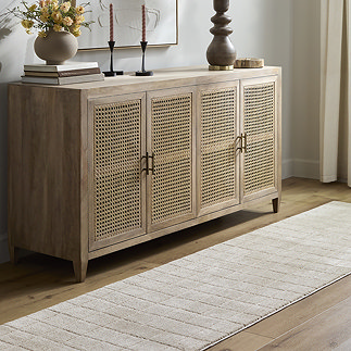 image of beige runner with square pattern on wood flooring in front of sideboard