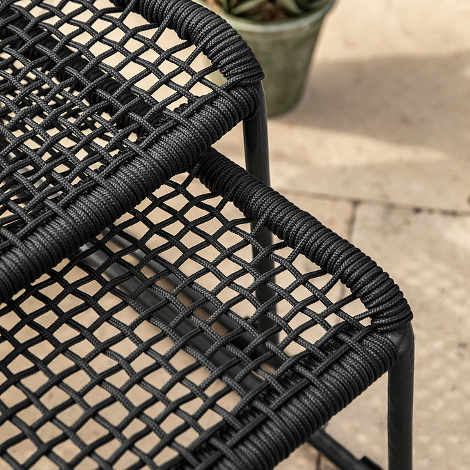 close up image of black rope material of garden chair