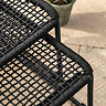 close up image of black rope material of garden chair
