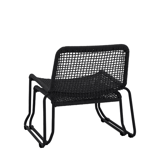 back image cut out of black rope chair with matching footstool tucked underneath it