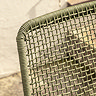 close up image of woven rope material of back of green garden chair
