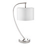 image cut out on white background of gently arched nickel table lamp with faux silk white shade