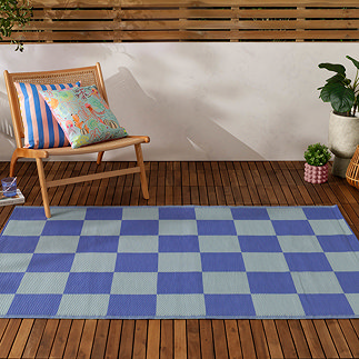 Checkerboard outdoor rug in blue image 1
