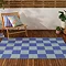 Checkerboard outdoor rug in blue image 1
