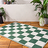 Checkerboard rug in green on floor image 1