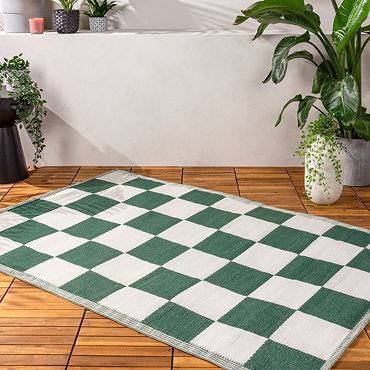 Checkerboard rug in green on floor image  2