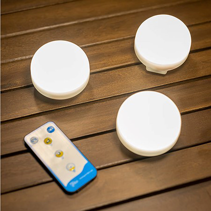 image of 3 round bulbs with remote on a dark wood garden table
