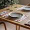 Christmas Bows placemats on dining table with cutlery