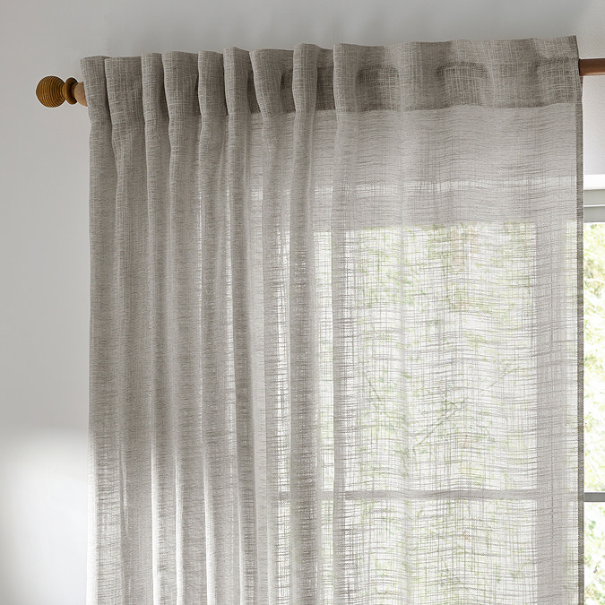 Cirrus Tab Top Sheer Curtain Panel in Grey over a window image