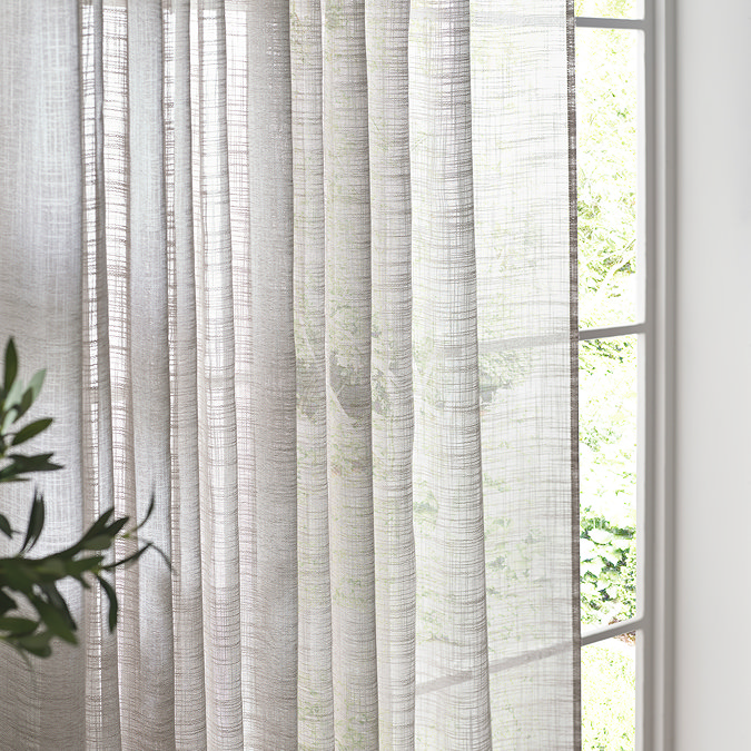 Cirrus Tab Top Sheer Curtain Panel in Grey over a window image