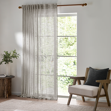 Cirrus Tab Top Sheer Curtain Panel in Grey over a window image