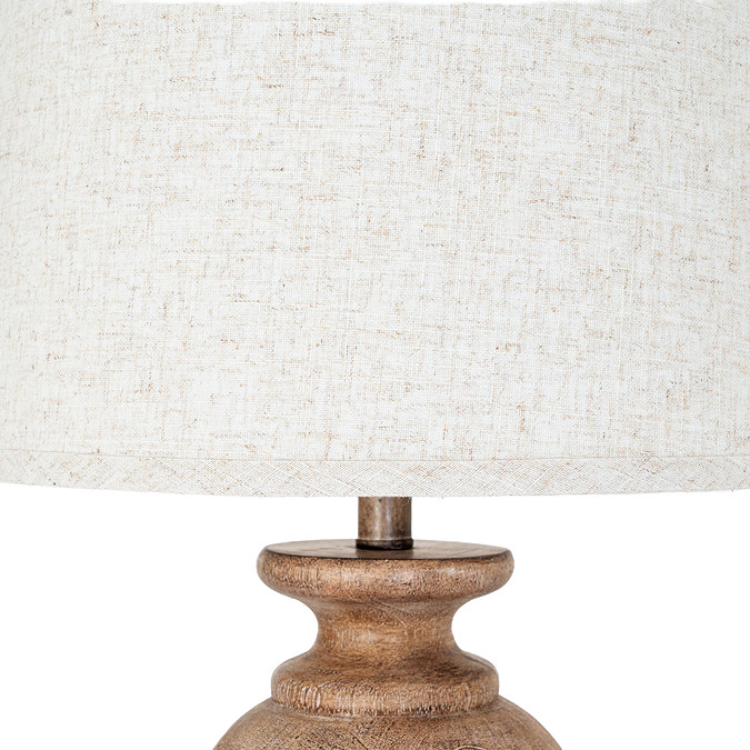 close up image of linen shade of brown resin lamp