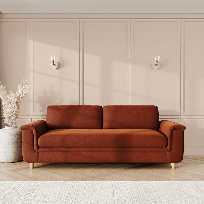 lifestyle image of grand sofa with sculpted arms and light oak feet, in umber velvet fabric