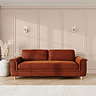 lifestyle image of grand sofa with sculpted arms and light oak feet, in umber velvet fabric