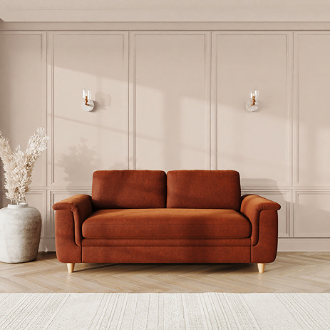 lifestyle image of large sofa with sculpted arms and light oak feet, in umber velvet