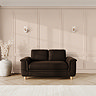 lifestyle image of medium sofa with sculpted arms and light oak feet, in cocoa velvet