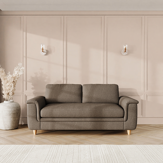 lifestyle image of large sofa with sculpted arms and light oak feet, in fallow chenille-velvet fabric