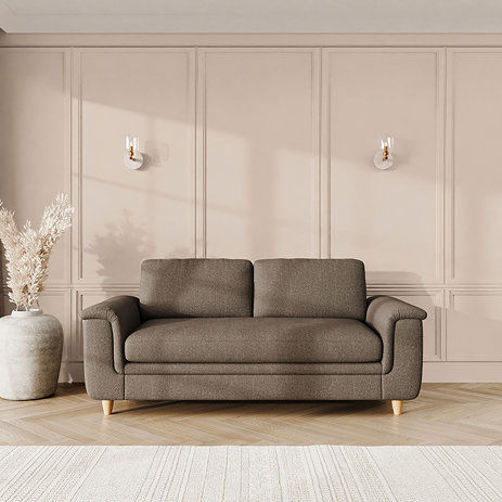 lifestyle image of large sofa with sculpted arms and light oak feet, in fallow chenille-velvet fabric