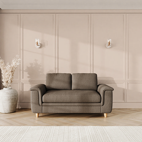 lifestyle image of grand sofa with sculpted arms and light oak feet, in fallow fabric