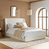 image of cream double ottoman bed against dusky clay coloured bedroom wall
