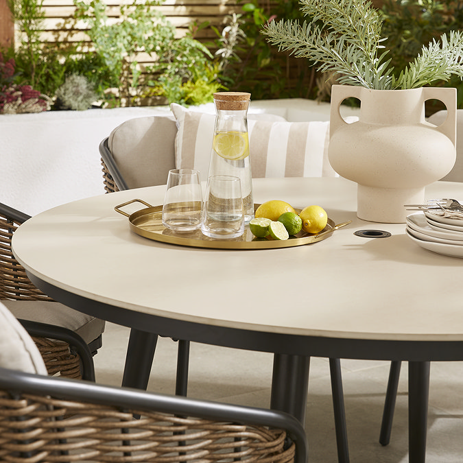 close up image of stone material of round garden dining table