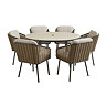 image cut out on white background of round stone sintered table with six wicker chairs with black legs