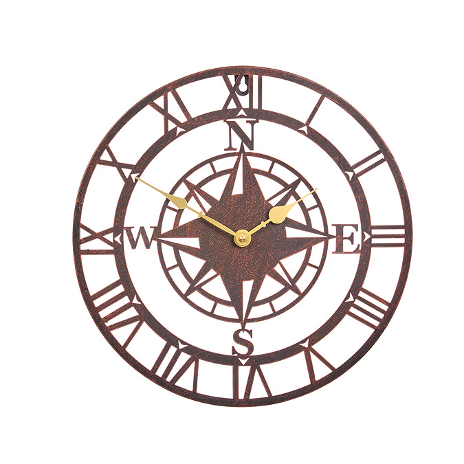 image cut out on white background of round bronze clock with central compass motif and gold hands