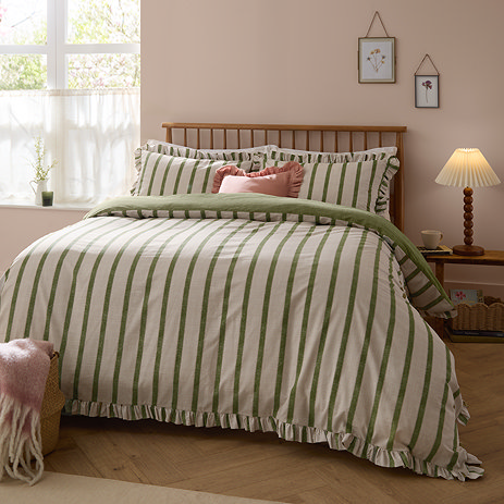 Connie in olive on bed image 1