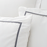 Contrast trim duvet cover set in white and black on bed image 3