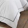 Contrast trim duvet cover set in white and black on bed image 4