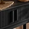 close up on closed drawers of console table with fluted design and rectangular vertical handles