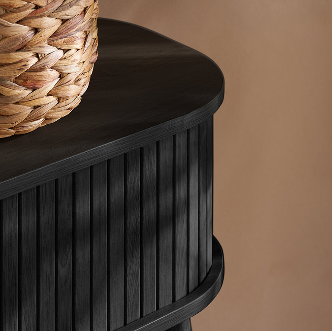 close up on smooth edge of console table with fluted drawer