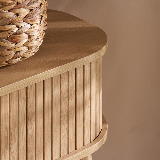 close up on rounded, smooth edge of the oak copenhagen console table with fluted drawer