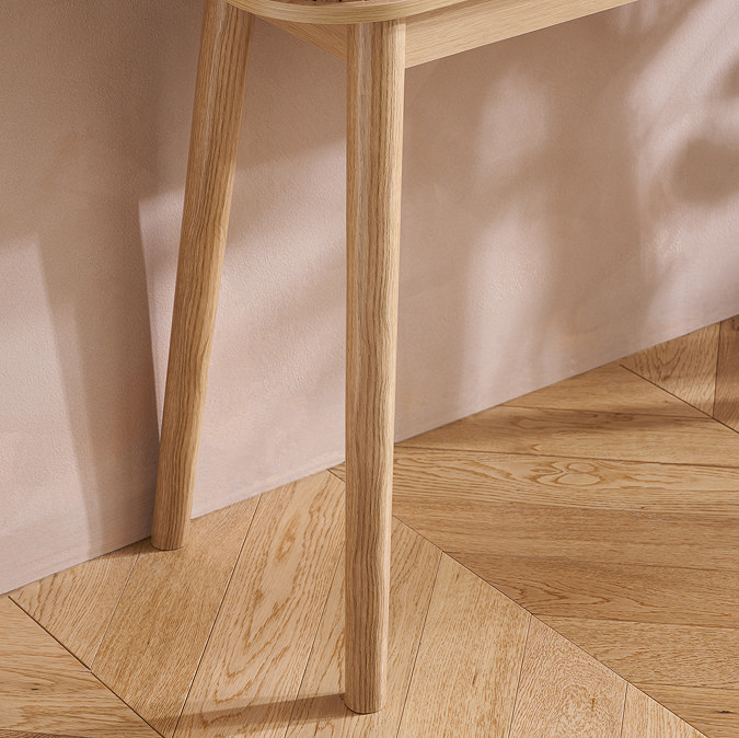 close up on oak wooden legs of console table