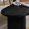 close up image on smooth black finish of oval dining bench