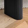 close up on fluted legs of black dining bench