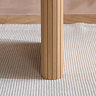 close up on fluted design of oak dining table leg