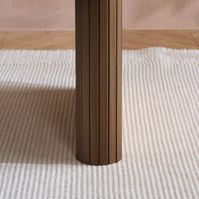 close up image of fluted legs of oval dining table