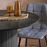 close up on smooth black wood effect table with grey chenille table tucked in