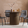 image of round walnut coloured dining table with fluted cylindrical base, four grey chairs around it